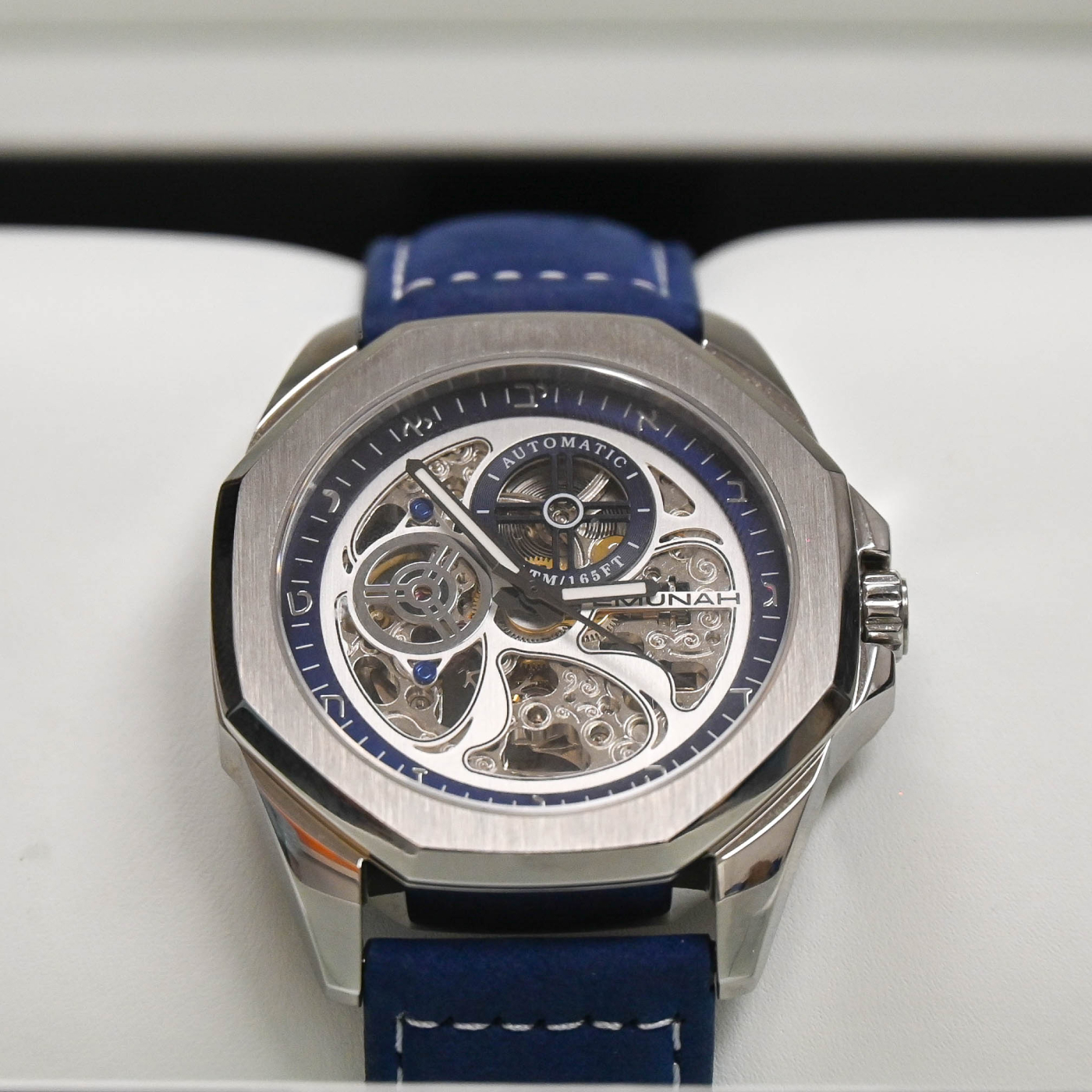 Photo of the Emnunah EC3100 timepiece in an open box (zoomed in)